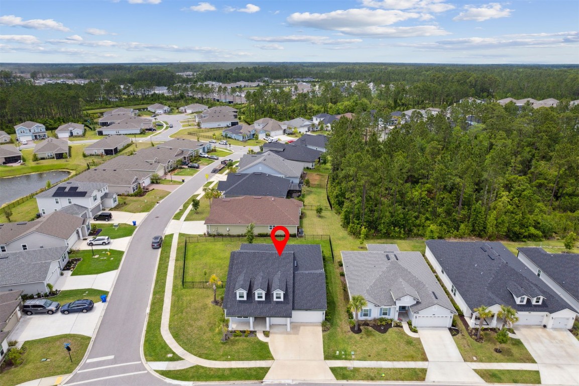 75251 White Rabbit Avenue Yulee, FL 32097 - Photo 47 of 83 an aerial view of a house with a garden