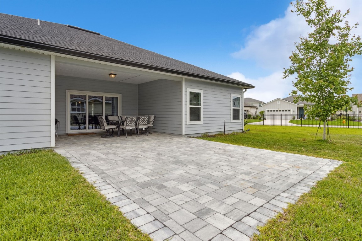 75251 White Rabbit Avenue Yulee, FL 32097 - Photo 6 of 83 a view of a house with a backyard