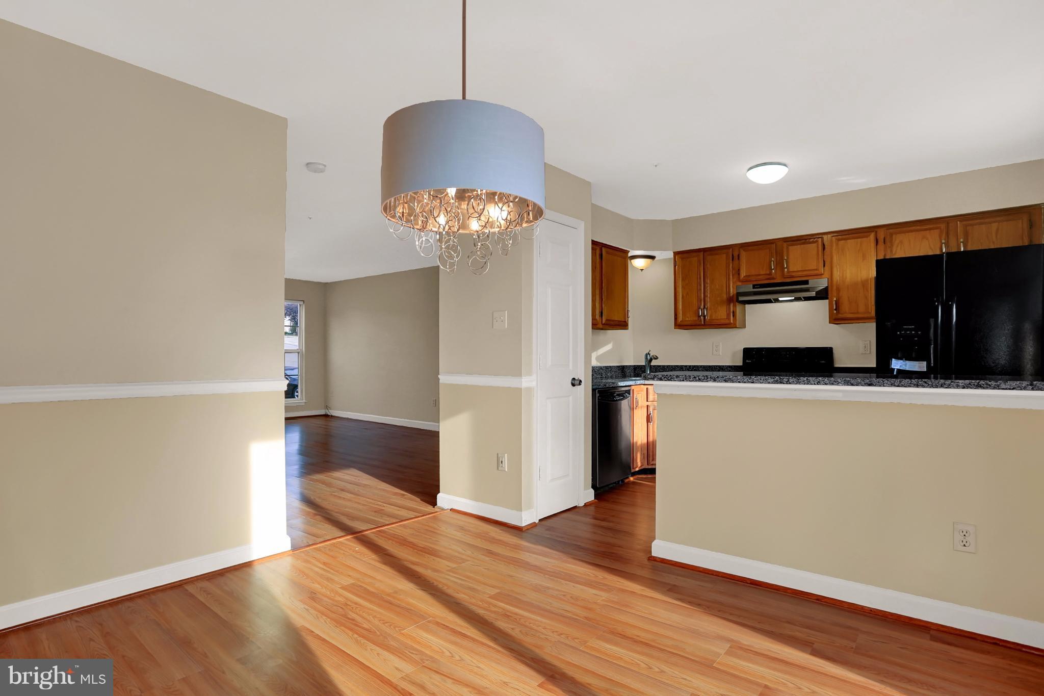 6428 View Point Court Frederick, MD 21703 - Photo 8 of 27 a kitchen with stainless steel appliances a refrigerator sink and microwave