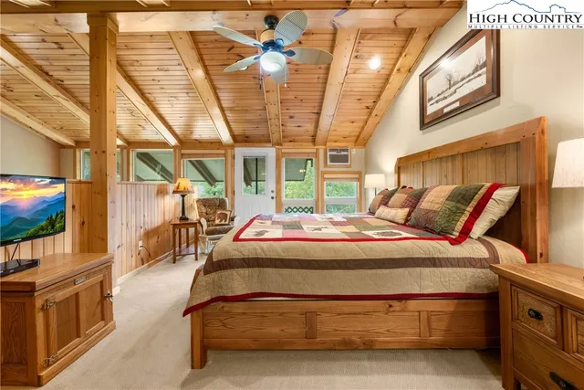 a bedroom with a bed and a desk