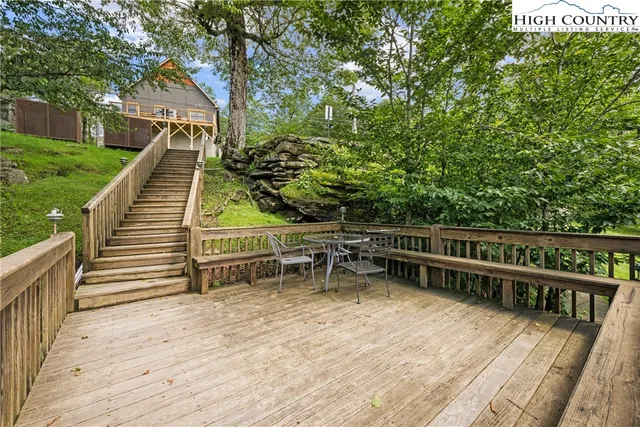 a view of a balcony with two chairs