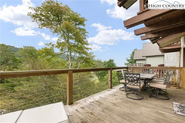 an aerial view of a house with yard swimming pool and outdoor seating