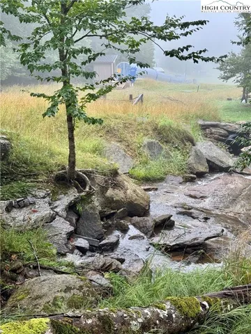 a living room with furniture fireplace and flat screen tv