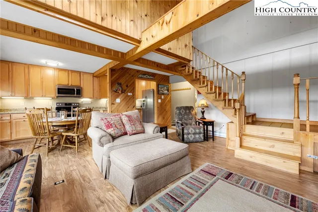 a kitchen with stainless steel appliances granite countertop sink stove top oven and cabinets