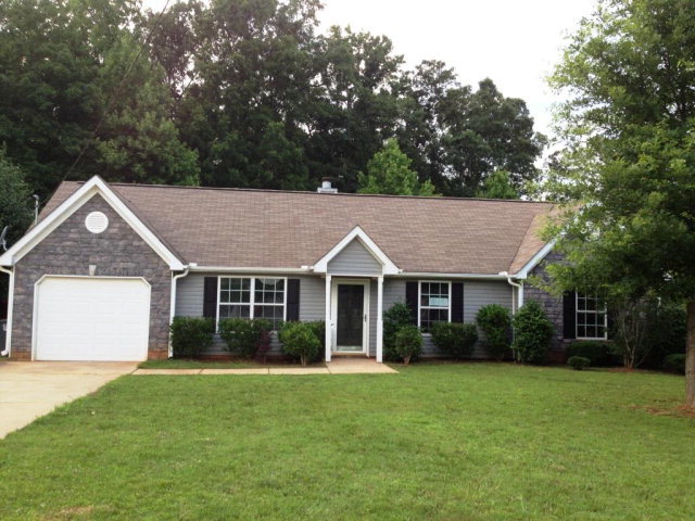 305 Autumn Ridge Trail Gray, GA 31032 - Photo 1 of 9 a front view of house with yard and green space