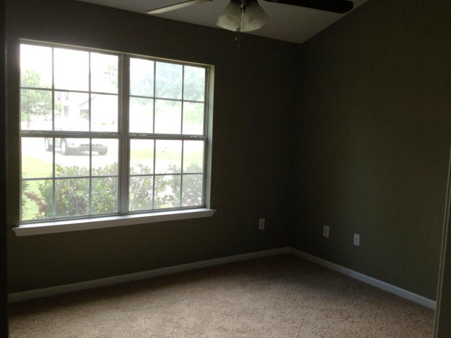 305 Autumn Ridge Trail Gray, GA 31032 - Photo 4 of 9 a view of an empty room with a window