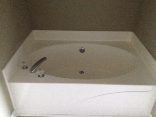 305 Autumn Ridge Trail Gray, GA 31032 - Photo 7 of 9 a bathroom with a bath tub