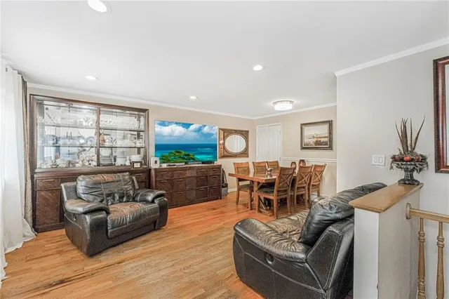 a kitchen with cabinets stainless steel appliances and a sink