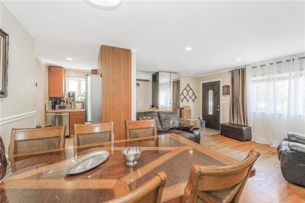 2809 East 28th Street, Unit 1C Brooklyn, NY 11235 - Photo 17 of 38 a living room with fireplace furniture and a large window