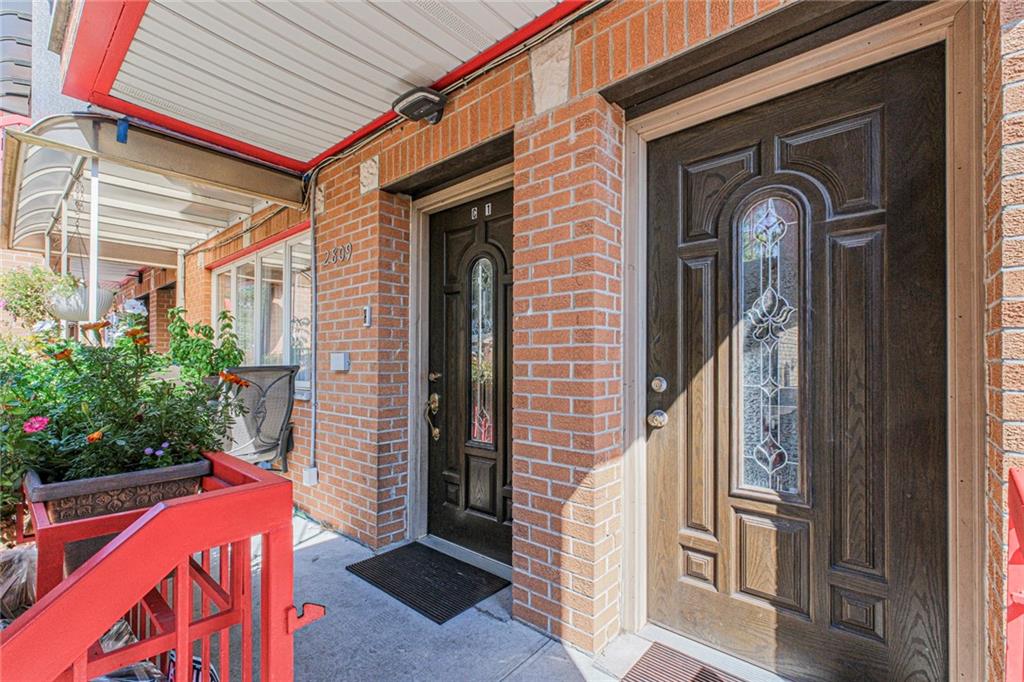 2809 East 28th Street, Unit 1C Brooklyn, NY 11235 - Photo 2 of 38 a front view of a house with a porch