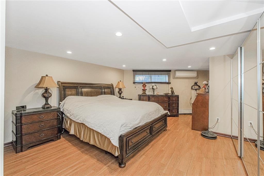 2809 East 28th Street, Unit 1C Brooklyn, NY 11235 - Photo 21 of 38 a bed room with a bed and a closet