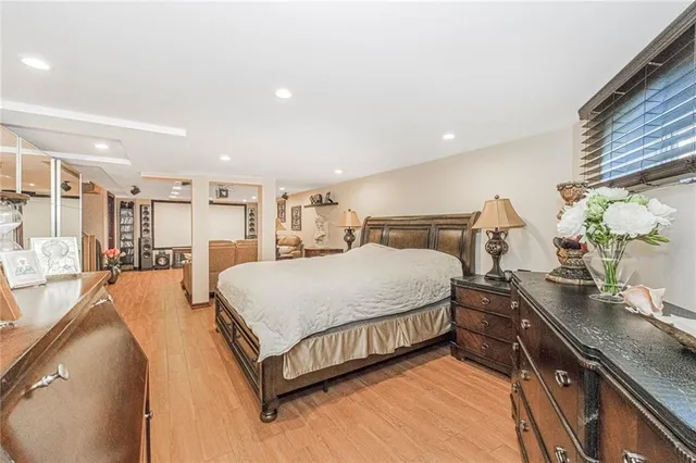 a bed room with a bed and a night stand