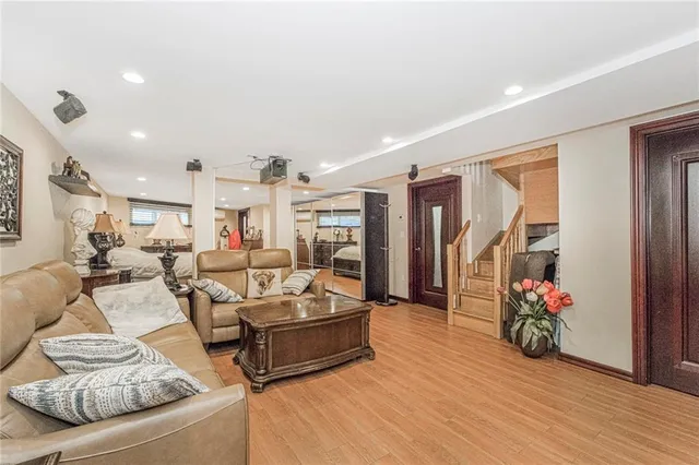 a room with furniture and a potted plant