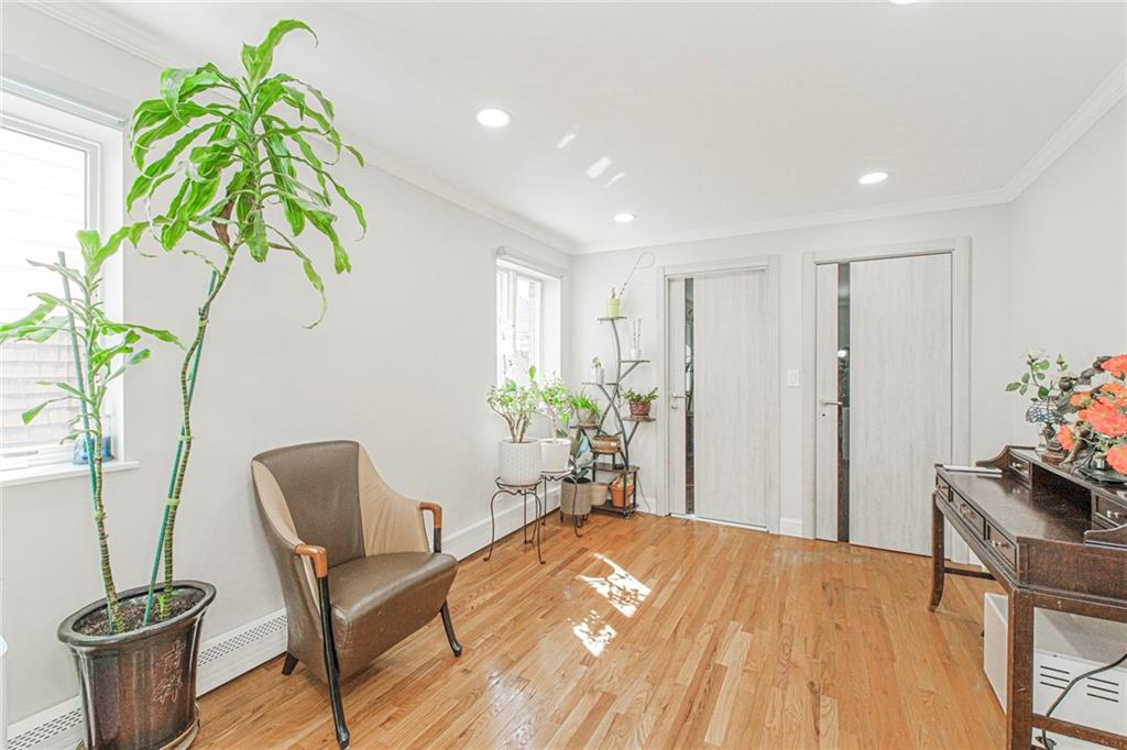 2809 East 28th Street, Unit 1C Brooklyn, NY 11235 - Photo 29 of 38 a workspace with furniture and a potted plant