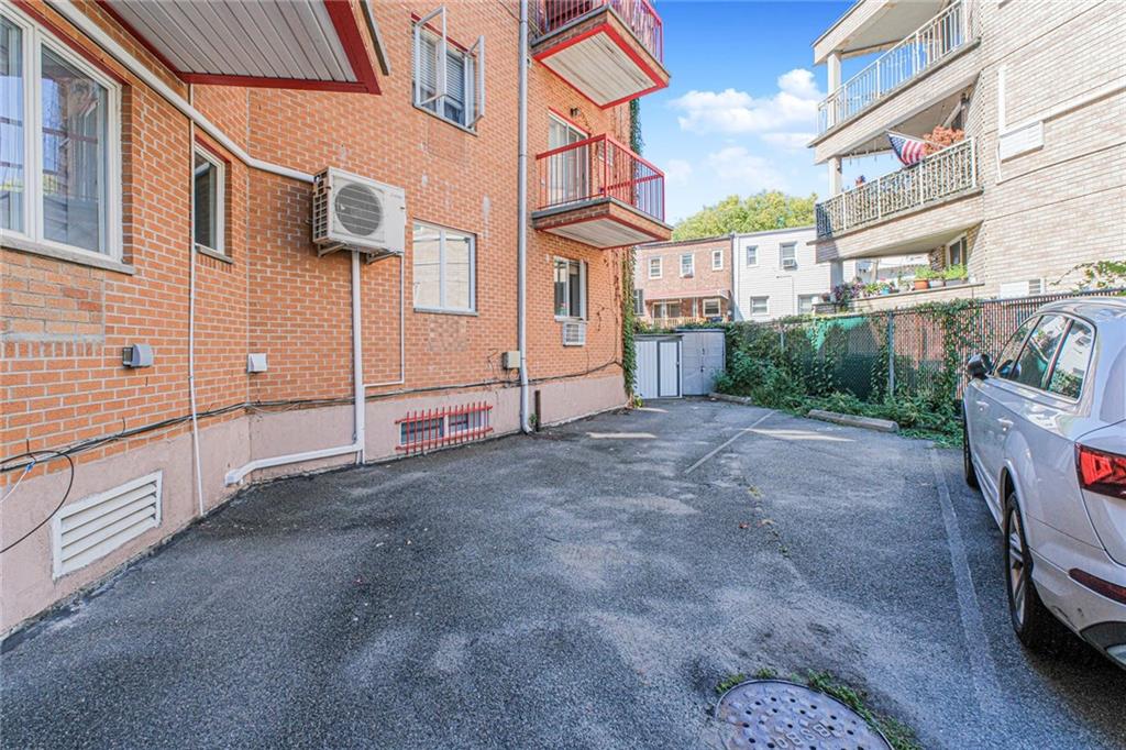 2809 East 28th Street, Unit 1C Brooklyn, NY 11235 - Photo 31 of 38 a view of a car park in front of a building