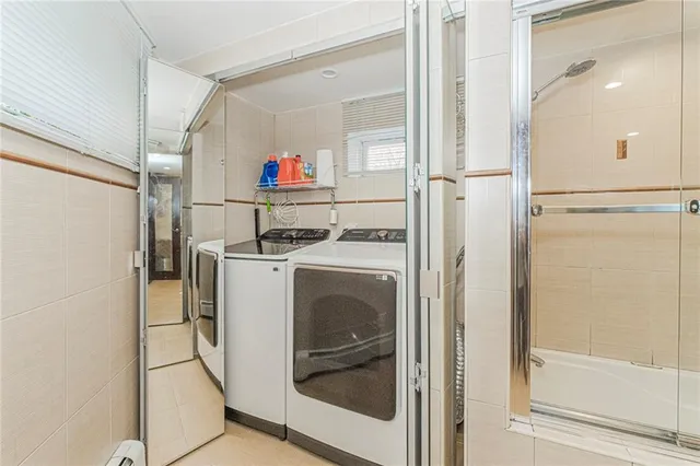 a bathroom with a glass shower door