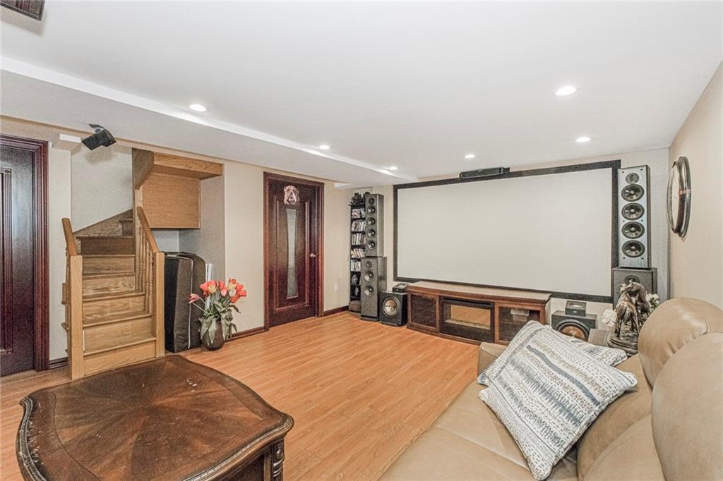 2809 East 28th Street, Unit 1C Brooklyn, NY 11235 - Photo 37 of 38 a bed room with a bed and a television