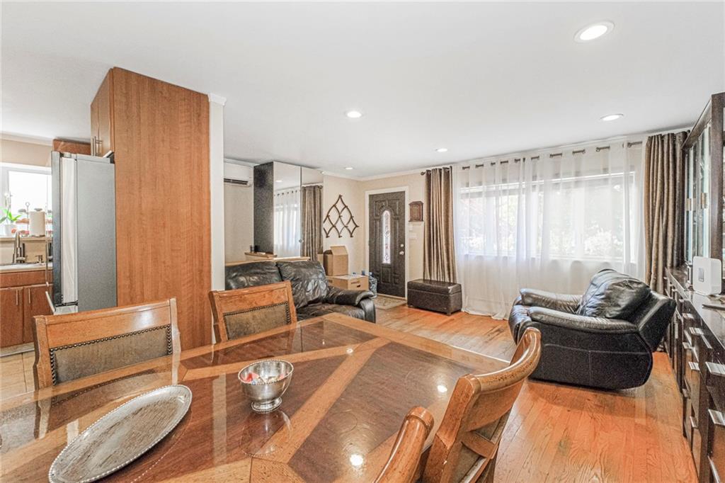 2809 East 28th Street, Unit 1C Brooklyn, NY 11235 - Photo 8 of 38 a large bedroom with a bed and a couch