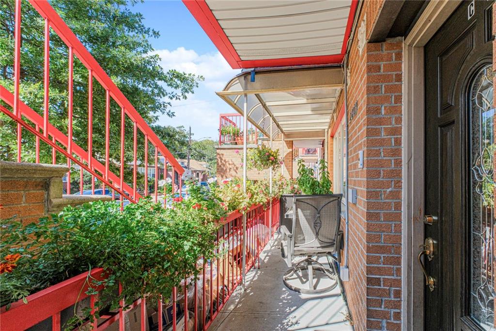 2809 East 28th Street, Unit 1C Brooklyn, NY 11235 - Photo 9 of 38 a view of balcony with wooden floor and outdoor space
