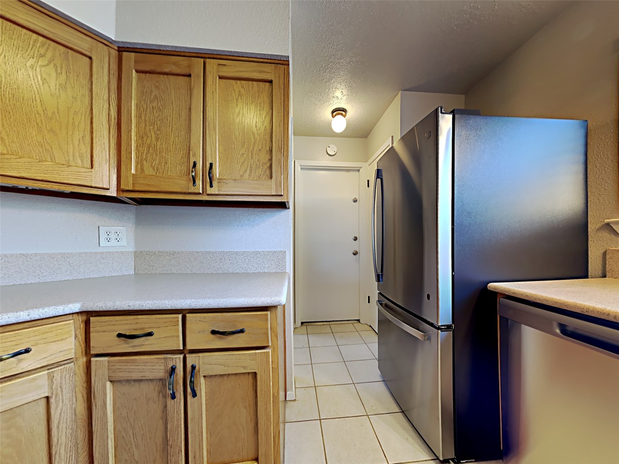 14919 Wainsfield Lane Channelview, TX 77530 - Photo 5 of 17 a kitchen with stainless steel appliances granite countertop a refrigerator and a stove