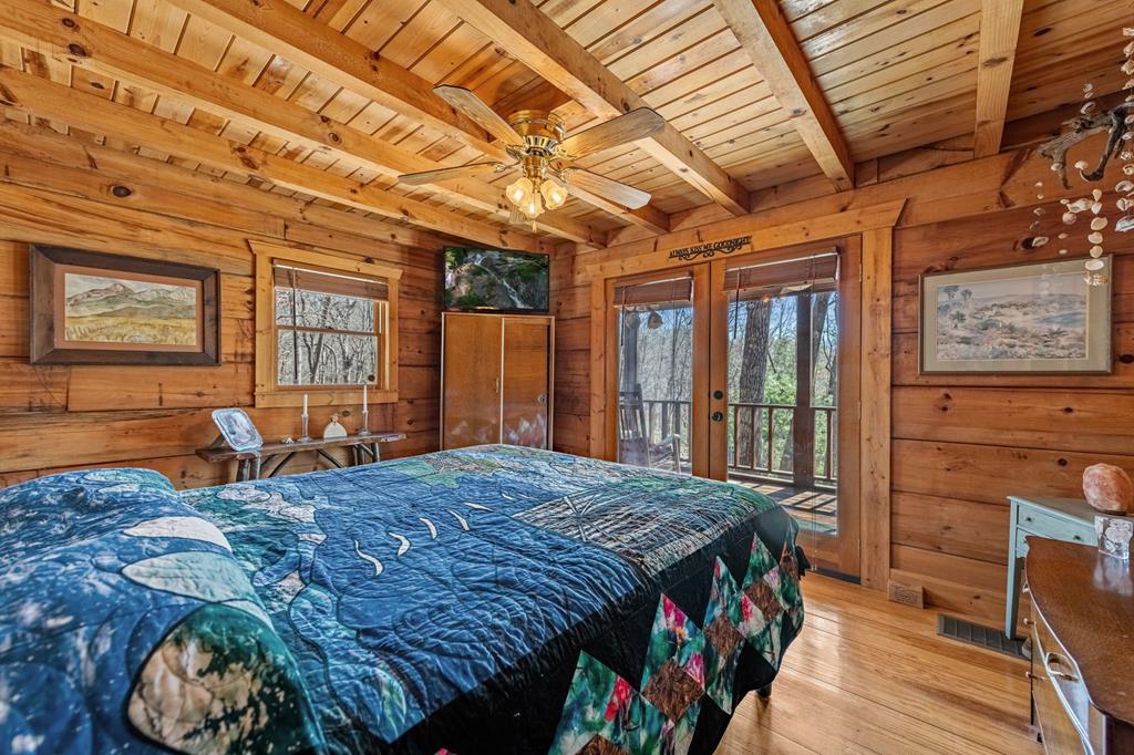 114 Hunter Hill Way Ellijay, GA 30540 - Photo 20 of 41 a bed sitting in a bedroom next to a window