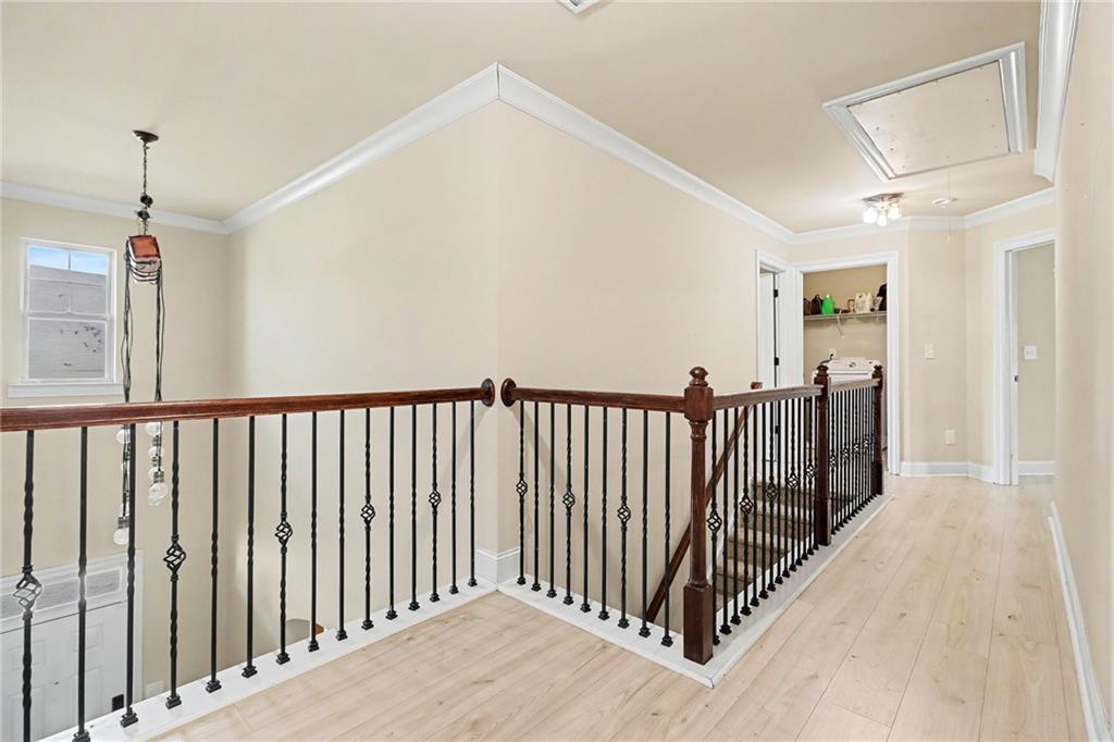 6791 Potomac Place Fairburn, GA 30213 - Photo 16 of 23 a view of a hallway with wooden floor and windows