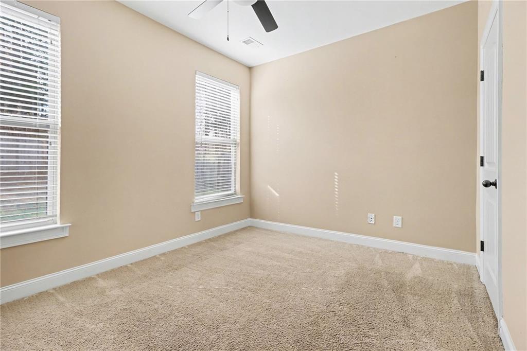 6791 Potomac Place Fairburn, GA 30213 - Photo 21 of 23 an empty room with windows and closet