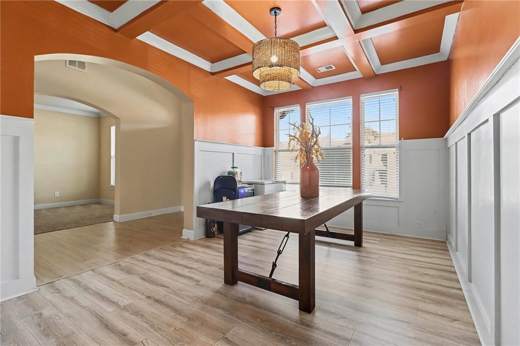 6791 Potomac Place Fairburn, GA 30213 - Photo 4 of 23 a view of a dining room with furniture window and wooden floor