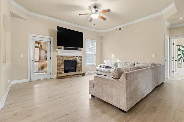 a living room with furniture fireplace and flat screen tv