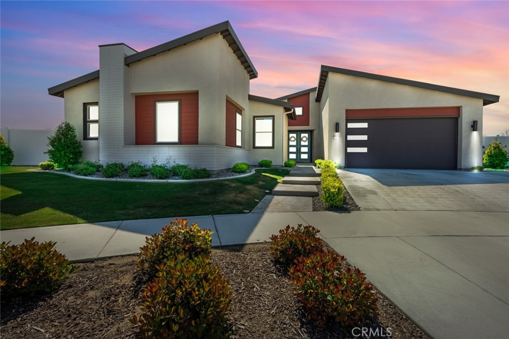 2018 Risborough Court Bakersfield, CA 93311 - Photo 1 of 73 a front view of a house with a yard and garage