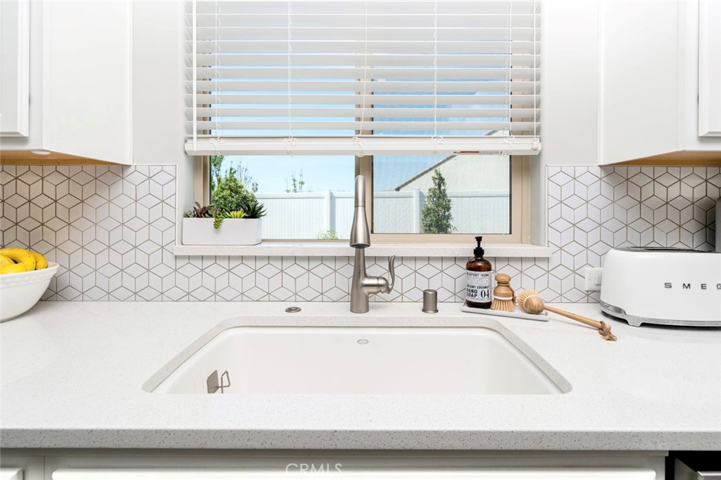2018 Risborough Court Bakersfield, CA 93311 - Photo 20 of 73 a bathroom with a sink and a large mirror