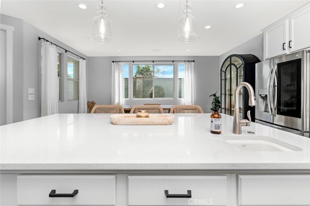 2018 Risborough Court Bakersfield, CA 93311 - Photo 21 of 73 a bathroom with a sink a large mirror and a window