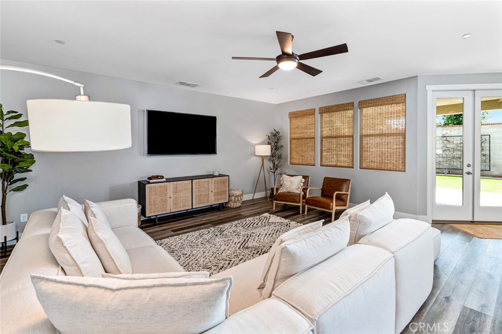 2018 Risborough Court Bakersfield, CA 93311 - Photo 26 of 73 a living room with furniture and a flat screen tv