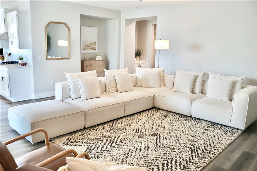2018 Risborough Court Bakersfield, CA 93311 - Photo 27 of 73 a living room with a couch and white walls