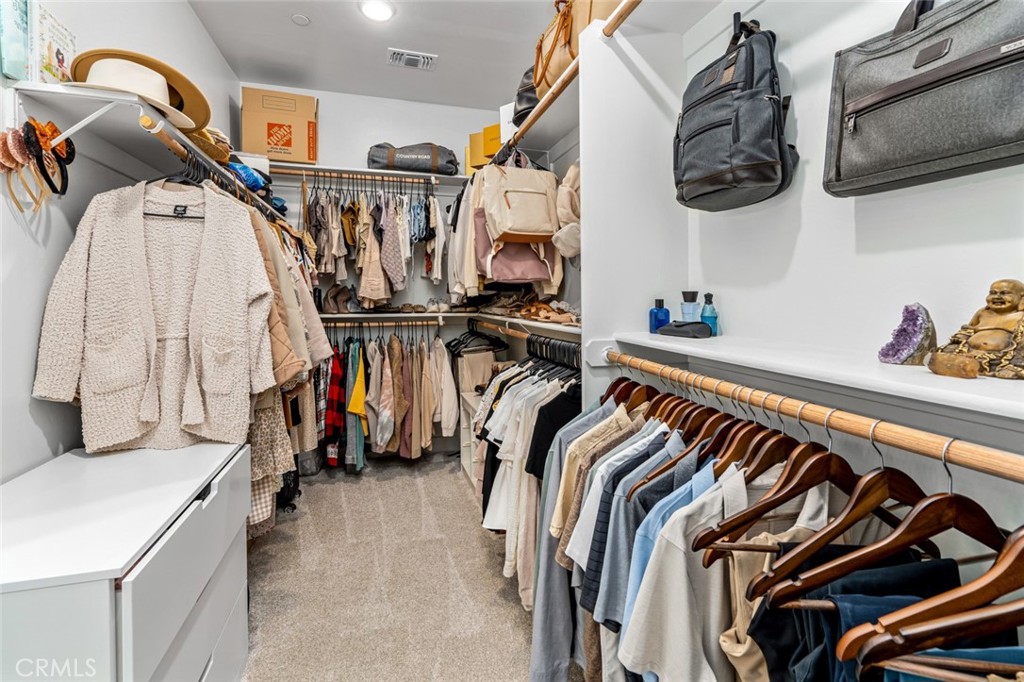 2018 Risborough Court Bakersfield, CA 93311 - Photo 31 of 73 a view of walk in closet with clothes and shoes