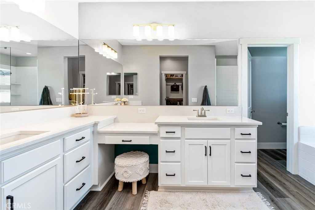 2018 Risborough Court Bakersfield, CA 93311 - Photo 32 of 73 a spacious bathroom with a double vanity sink and a mirror