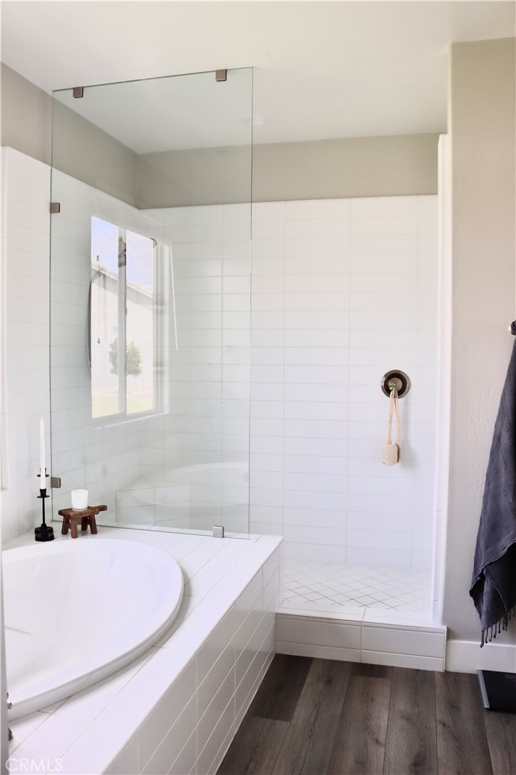2018 Risborough Court Bakersfield, CA 93311 - Photo 35 of 73 a bathroom with a tub sink and mirror