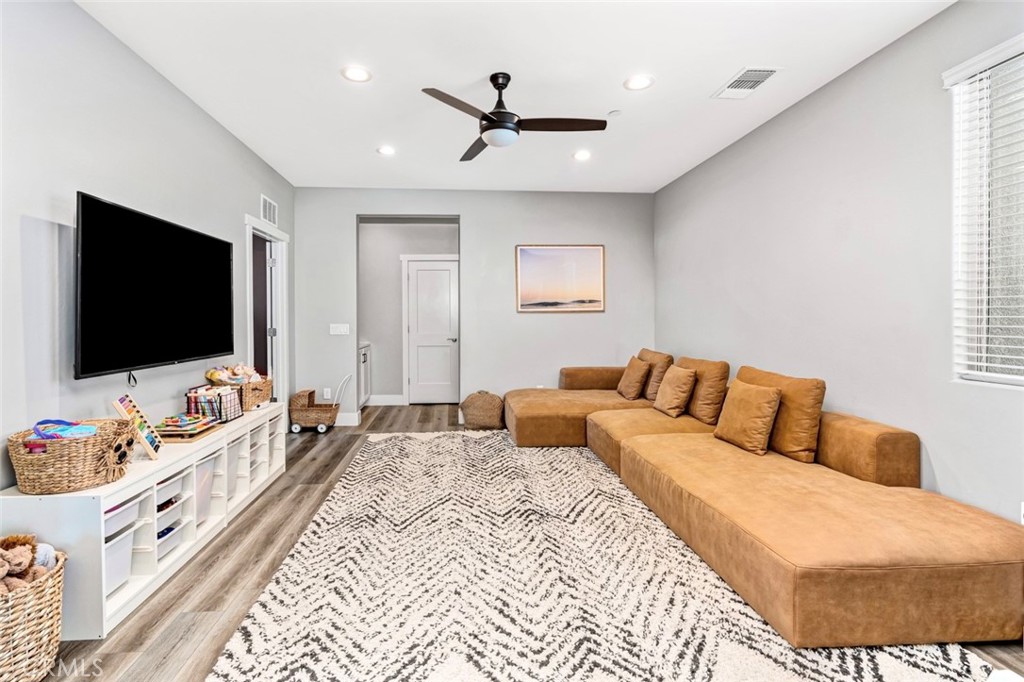 2018 Risborough Court Bakersfield, CA 93311 - Photo 38 of 73 a bedroom with a bed and a flat screen tv