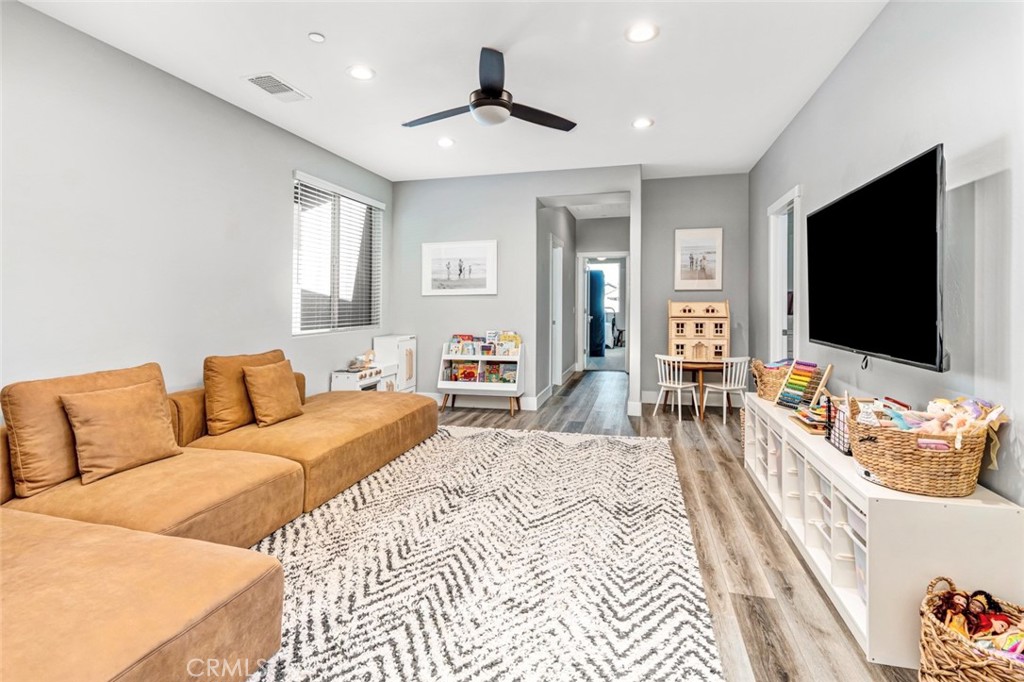 2018 Risborough Court Bakersfield, CA 93311 - Photo 39 of 73 a bedroom with a bed and a flat screen tv