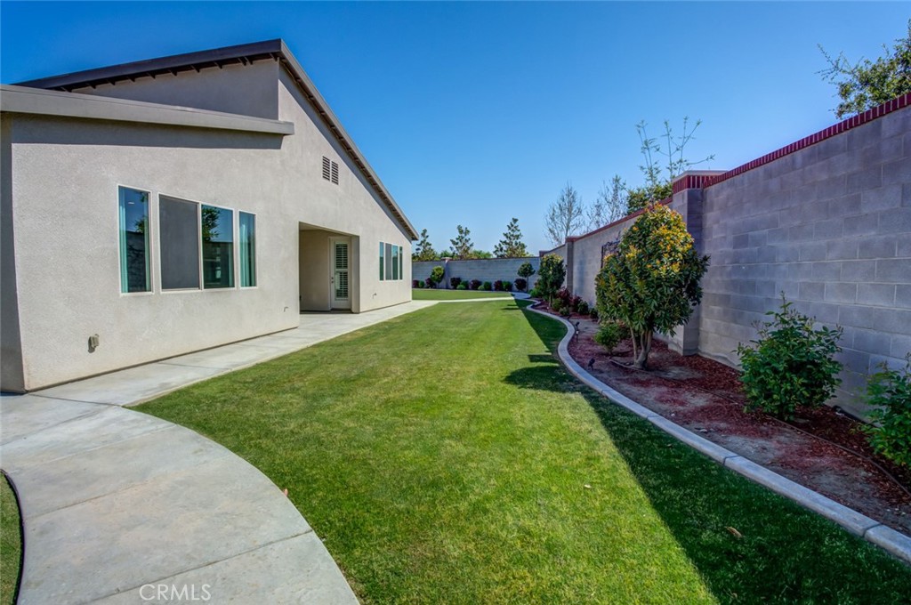 2018 Risborough Court Bakersfield, CA 93311 - Photo 52 of 73 a view of house with backyard