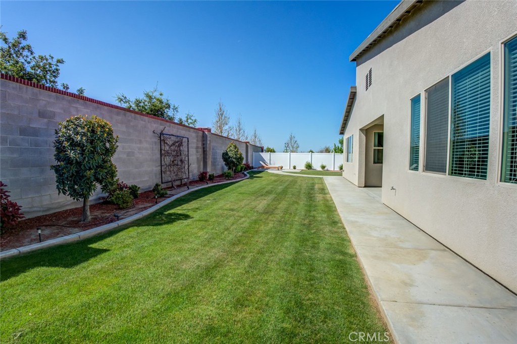 2018 Risborough Court Bakersfield, CA 93311 - Photo 55 of 73 a backyard of a house with lots of green space