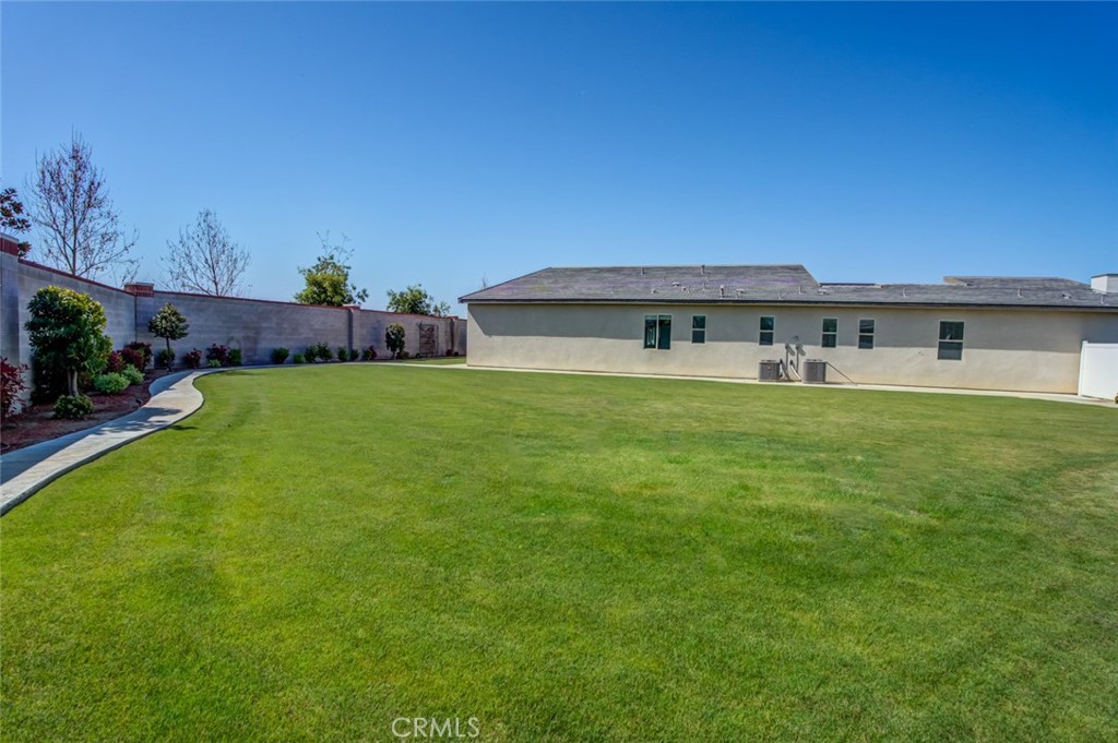 2018 Risborough Court Bakersfield, CA 93311 - Photo 57 of 73 a view of a house with a yard and sitting area