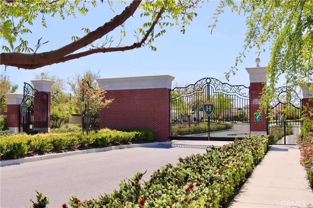 2018 Risborough Court Bakersfield, CA 93311 - Photo 60 of 73 a front view of a house with a yard and fountain in middle