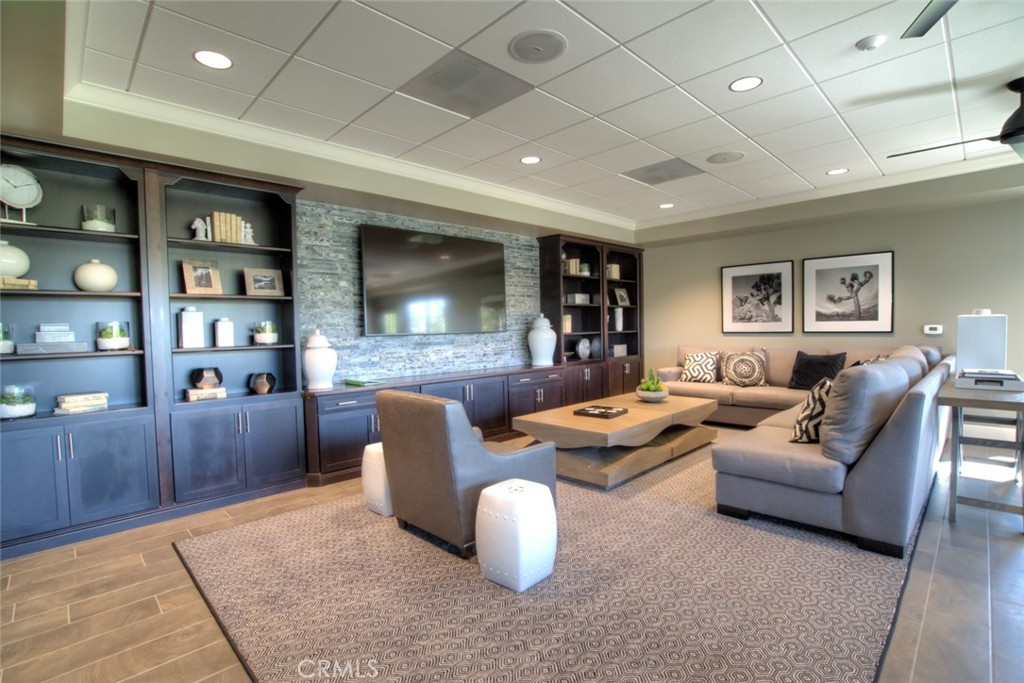 2018 Risborough Court Bakersfield, CA 93311 - Photo 72 of 73 a living room with furniture and a flat screen tv