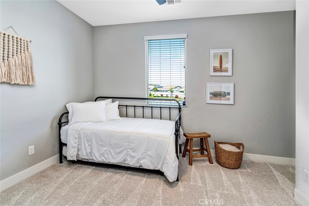 2018 Risborough Court Bakersfield, CA 93311 - Photo 8 of 73 a bedroom with a bed and a table