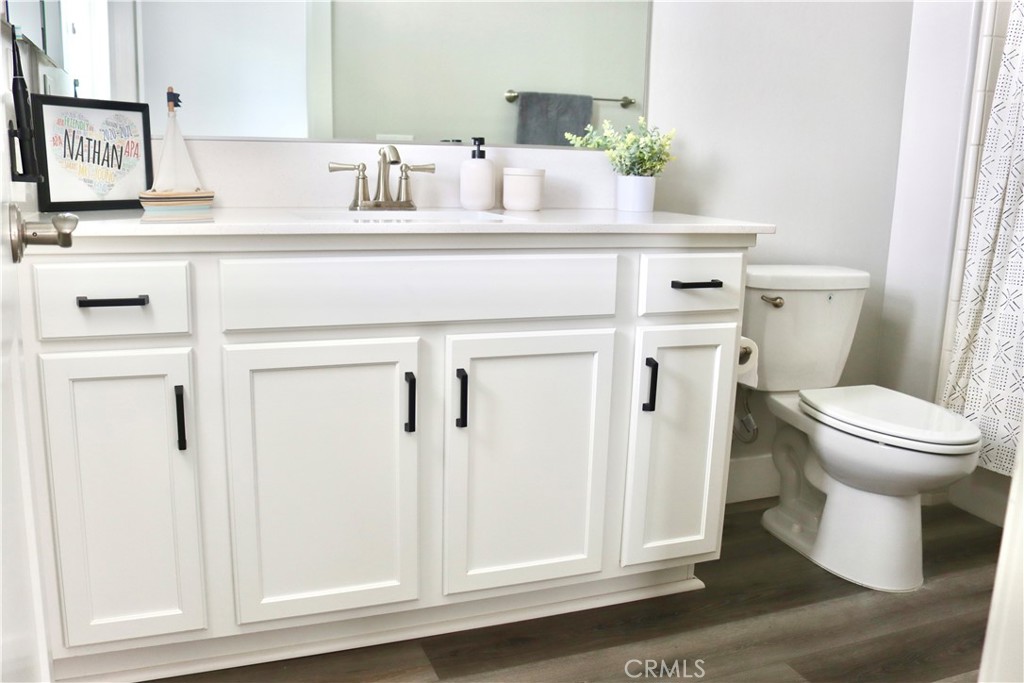 2018 Risborough Court Bakersfield, CA 93311 - Photo 9 of 73 a bathroom with a sink toilet and mirror