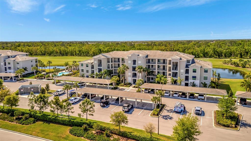 17724 Gawthrop Drive, Unit 101 Bradenton, FL 34211 - Photo 1 of 28 a view of a city with lawn chairs