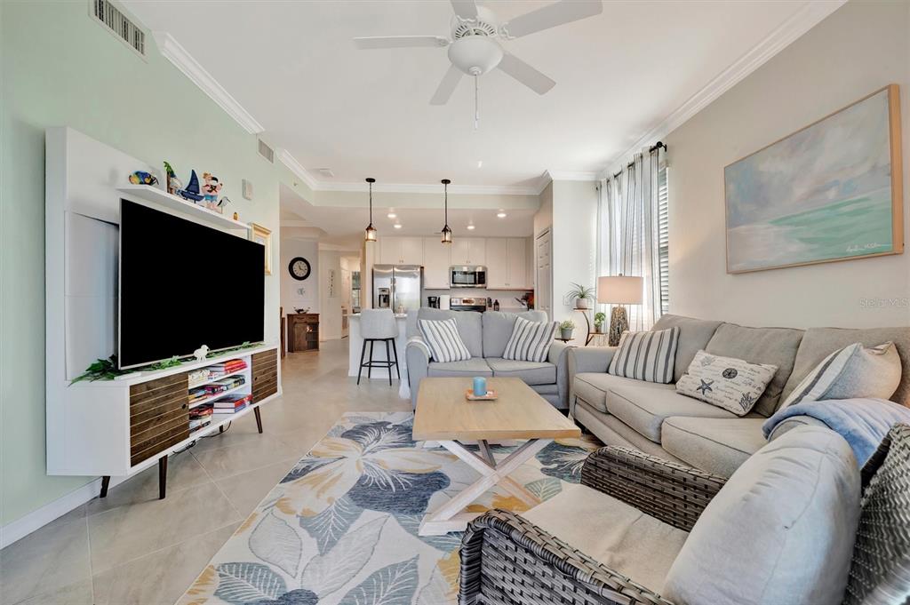 17724 Gawthrop Drive, Unit 101 Bradenton, FL 34211 - Photo 14 of 28 a living room with furniture and a flat screen tv