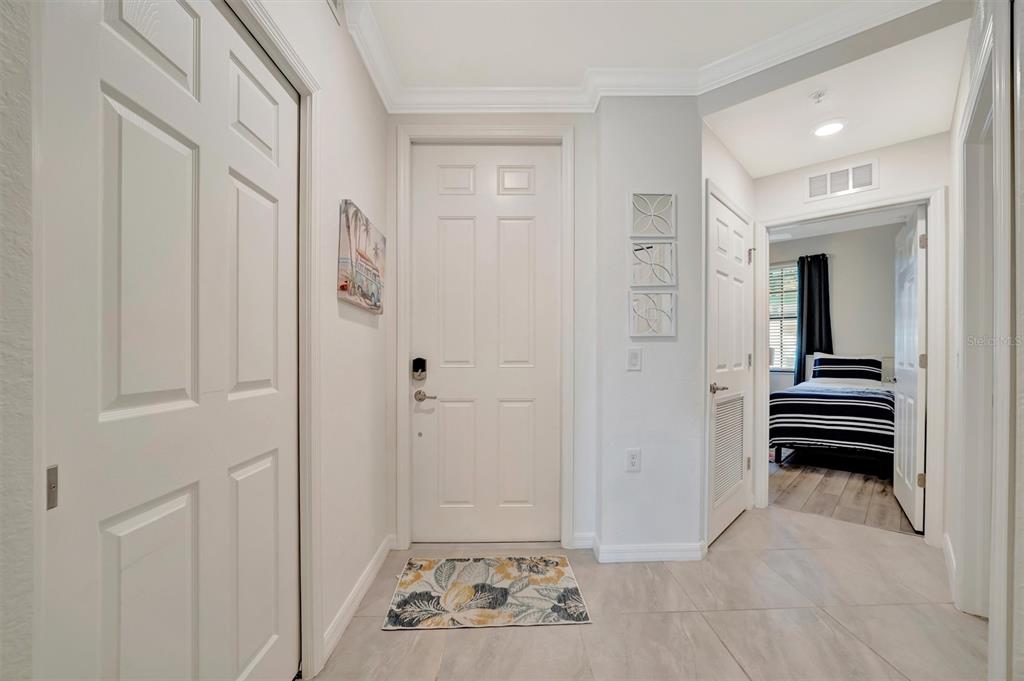 17724 Gawthrop Drive, Unit 101 Bradenton, FL 34211 - Photo 17 of 28 a view of a hallway with a livingroom and a bathroom