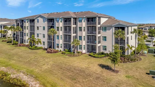 a view of a big house with many windows